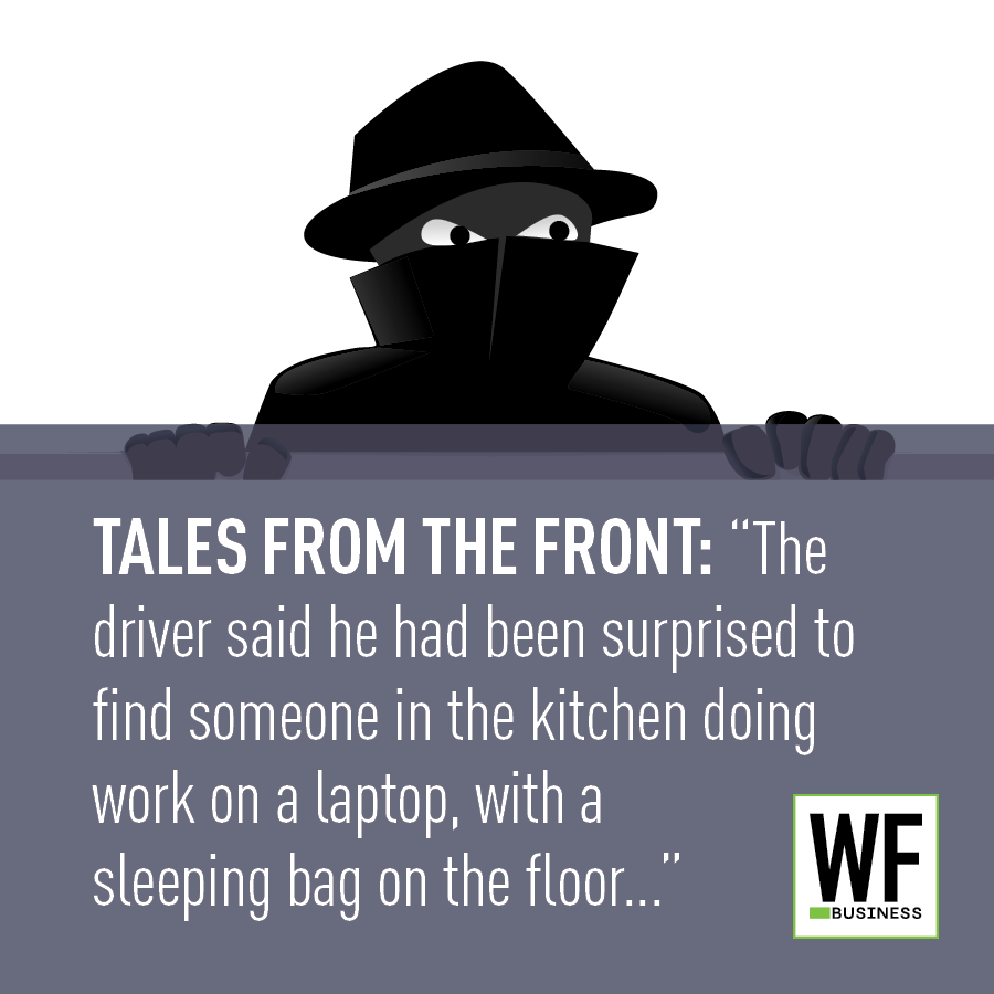 Mysterious figure in fedora and mask peering over wall with WE Business logo, illustrating security breach narrative