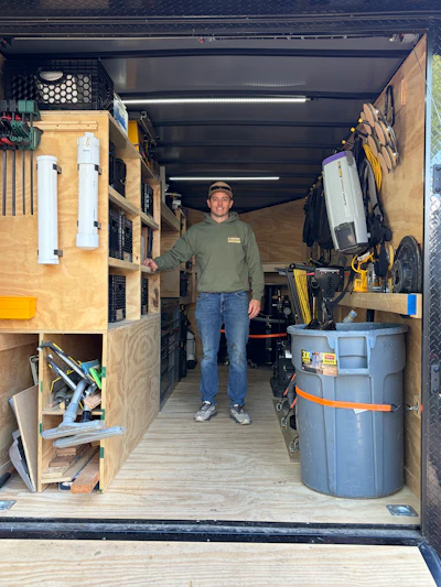 Rankin's carpenter friend helped him build his storage system, including a rack along the passenger's side to hold all his buffer pads and hooks for cords.