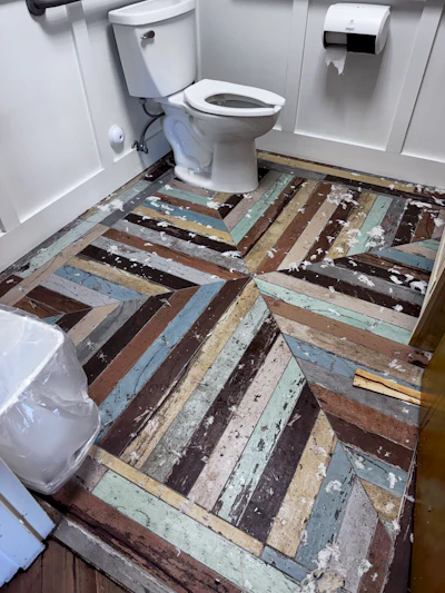 The water from the sewer backup soaked into the subfloor, leaving bits of toilet paper, 'flushable' Booty Wipes and ... other things ... behind.