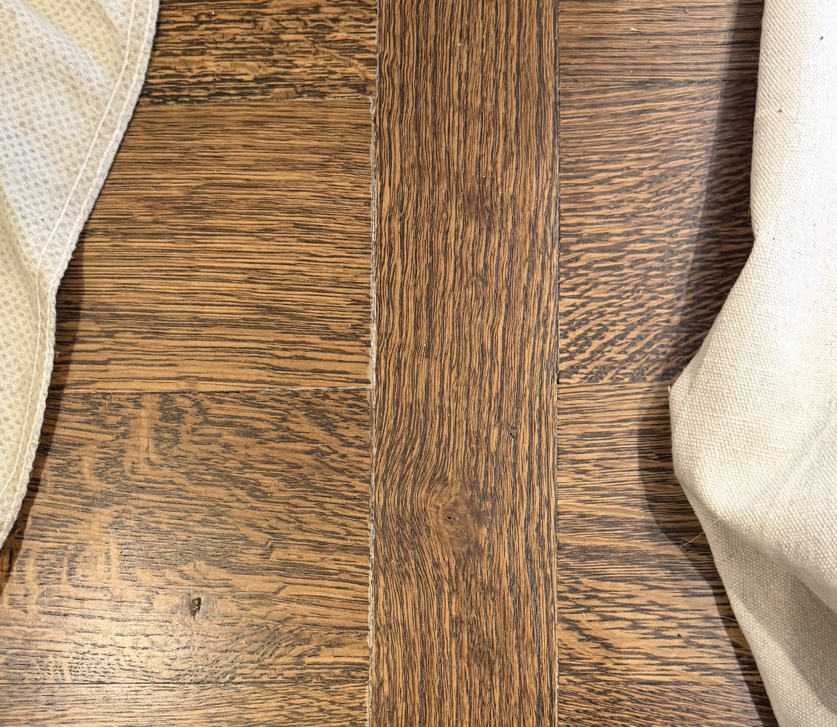 White lines along board edges are one common result from not waiting long enough for stain to dry before coating.