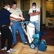 Todd McDonald (center) teaches at an NWFA school in St. Louis in December 2000.