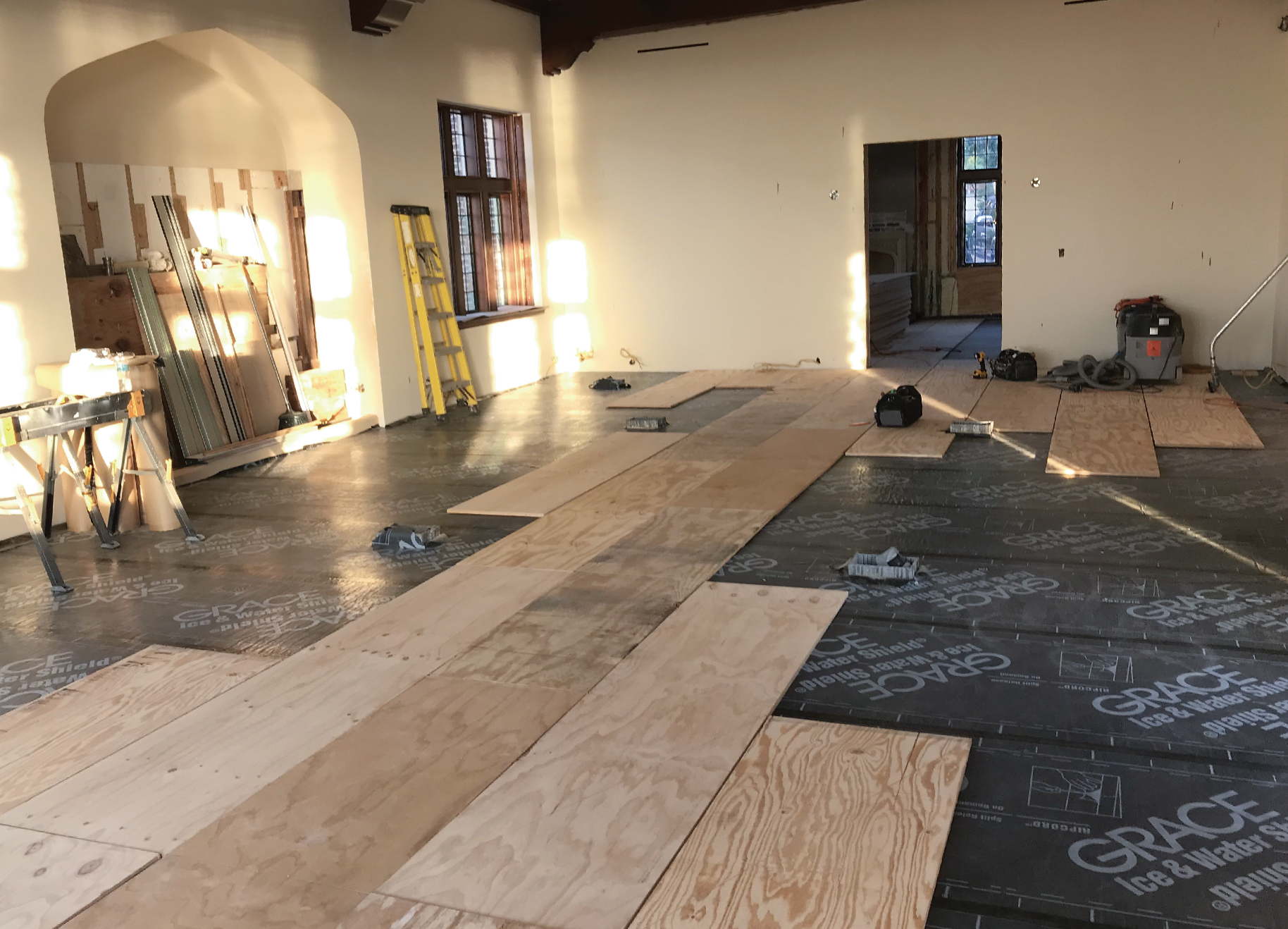 The single-layer plywood subfloor creates less of a height difference and saves money on adhesive.