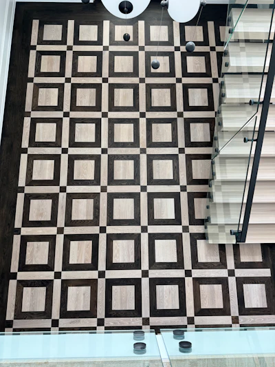 The time it took the Integrity Floors team to finish this high-contrast residential wood floor was cut drastically thanks to LED-cured stains.