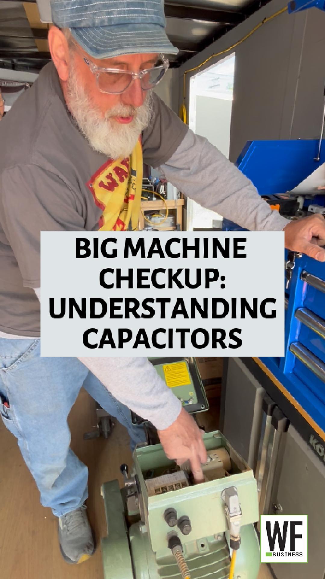 Technician examining capacitor components in workshop during equipment maintenance training