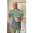 Man in gray shirt sharing table saw safety story, wearing safety glasses and work gloves in workshop