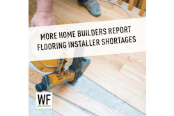 Flooring installer using pneumatic nailer on wooden floor with WE Business logo