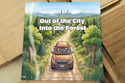 Children's book cover showing a brown SUV driving down a forest road with city skyline visible in the distance