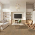 Modern open-concept living room with neutral furnishings, wood flooring, wall-mounted TV, and abundant natural light from large windows