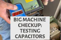 Technician testing capacitors inside industrial machine control panel during maintenance checkup