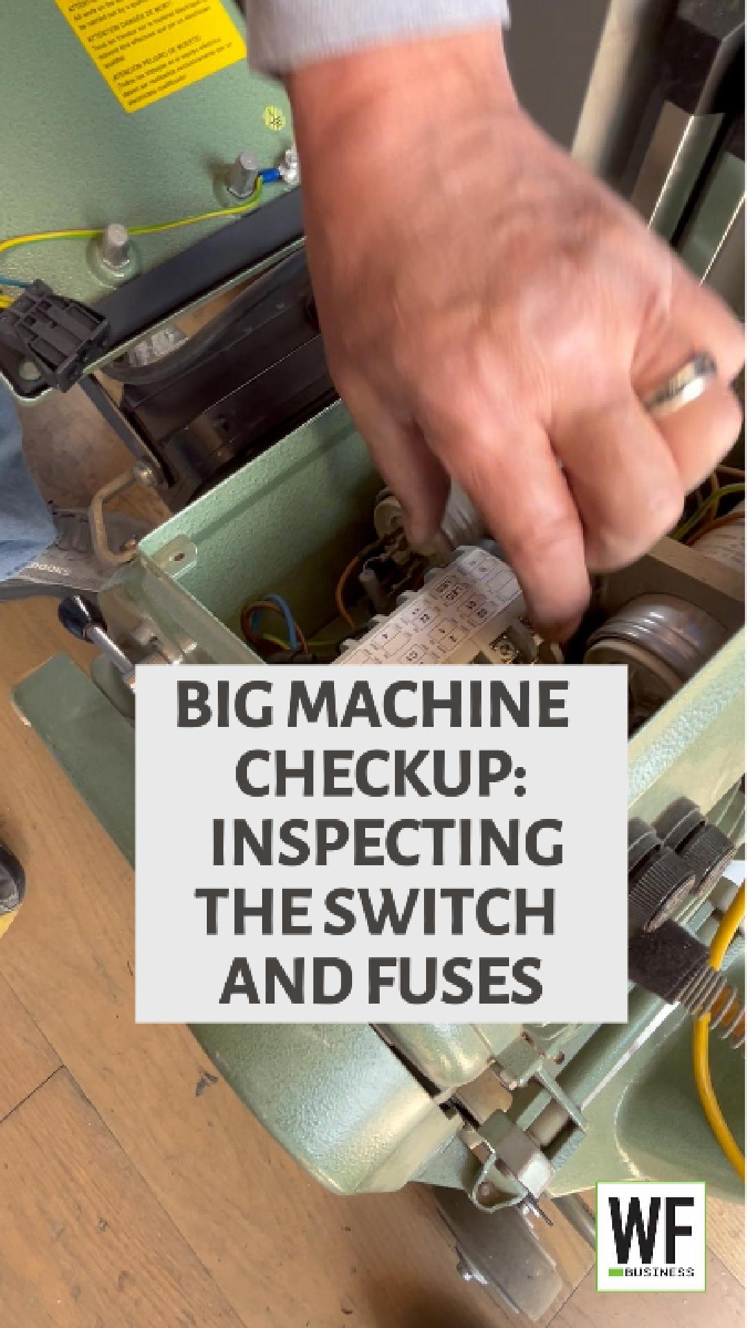 Technician inspecting electrical switches and fuses inside industrial machinery during maintenance checkup